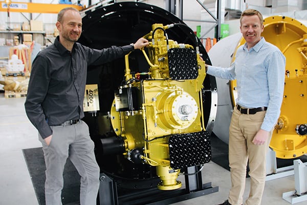 Erik Veth (left) and Tim Batten (right) traveled to Greece to deliver a special edition, golden thruster, the 4,000th thruster produced by Veth Propulsion since the first was built in 1986.